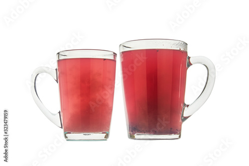 Two glass cups with berry tea isolated on white background