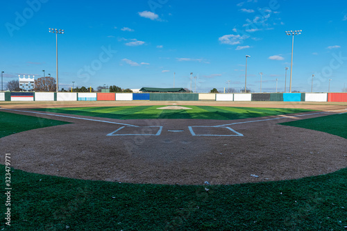 Baseball field with artificial turf on sunny day photo