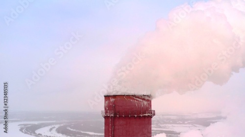 A huge Steam pillar from the power plant or factory pipe, close up. photo