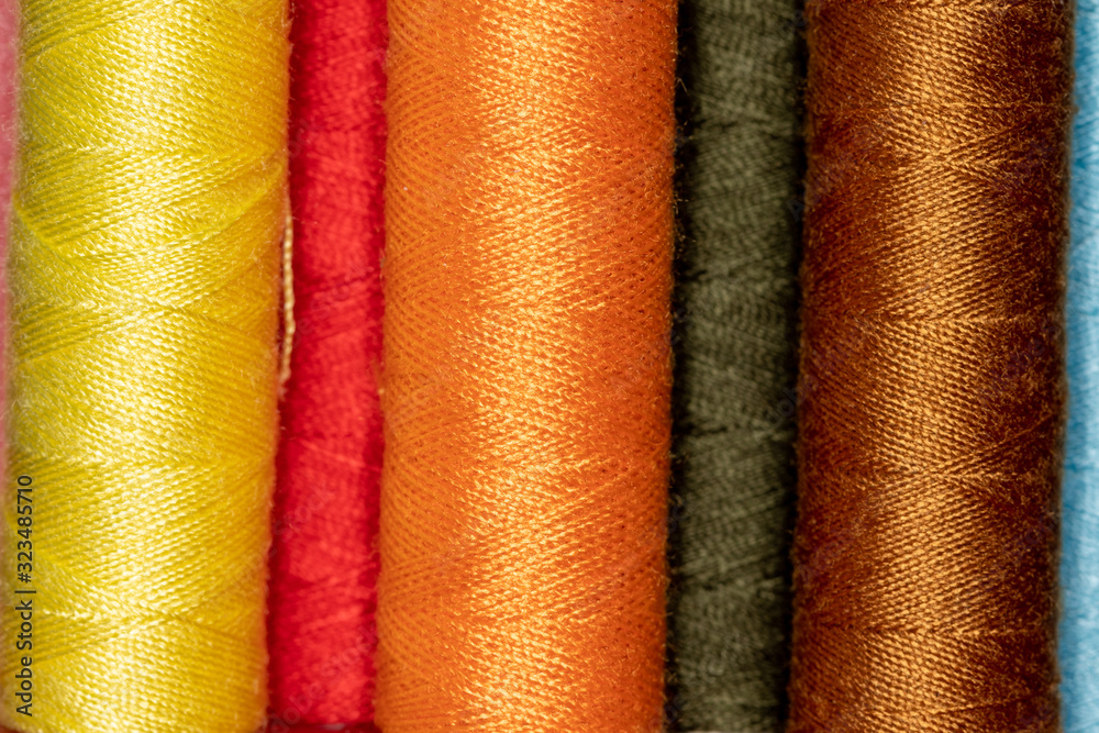 Cones with bright colored sewing thread Cones with bright colored sewing thread