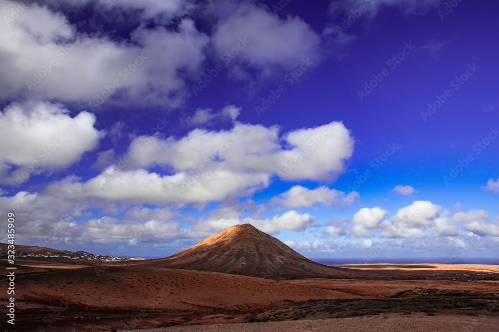 Tindaya Mountain in fuerteventura, canary islands, spain with dramatic sky.