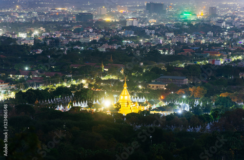 Sanda muni pagoda in Mandalay, at night time. View from the hills out the city photo