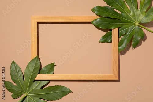 Hipster summer flat lay with border on beige background. Green tropical Palm ...