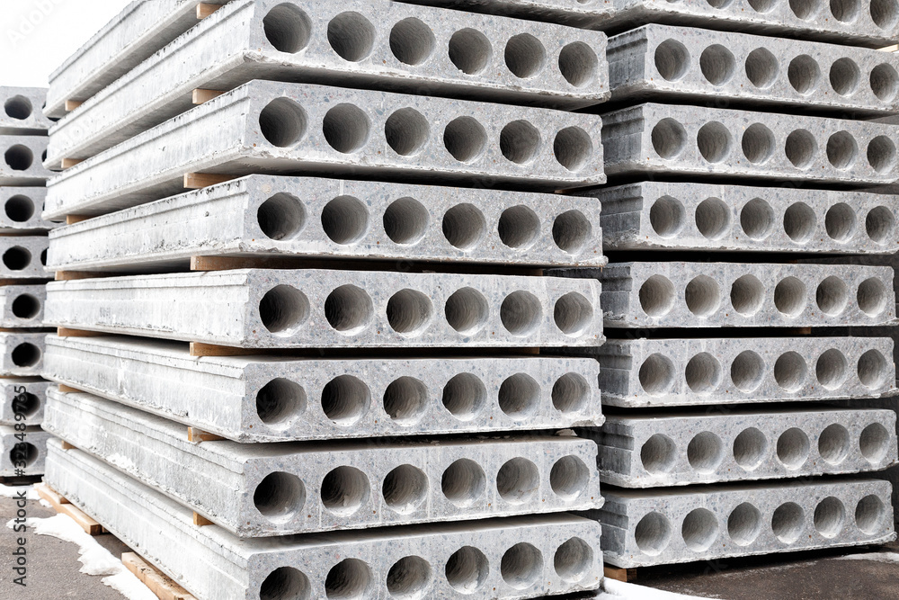 Stack of Prefabricated concrete slabs with hole for construction. Stack of Prefabricated concrete slabs with hole for construction.
