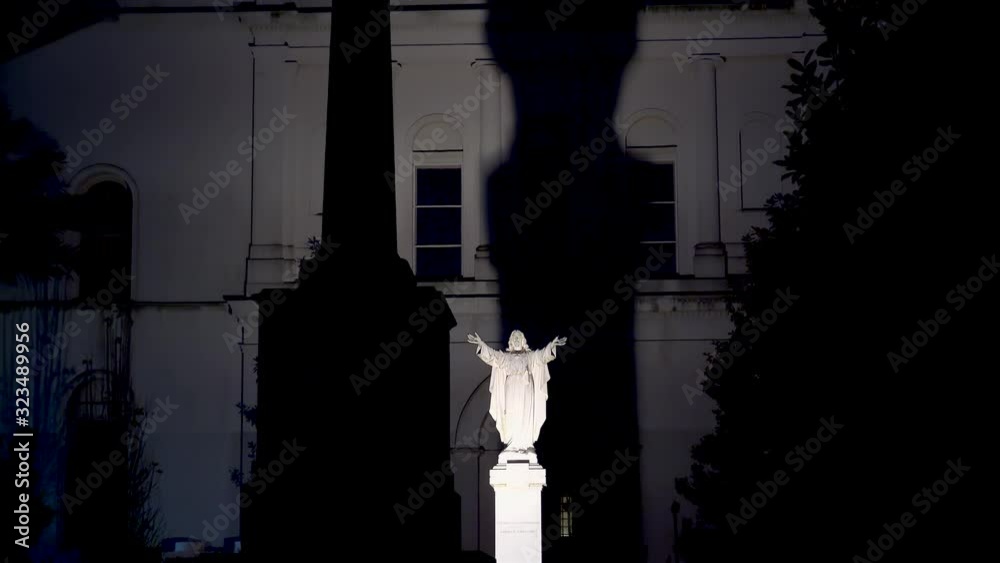 Jesus Christ statue with the huge shadow on the back side of St. Louis