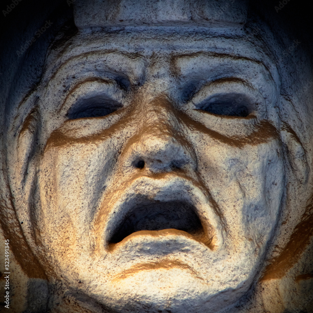 Fragment of ancient statue of god of fear Phobos (greek mythology). He