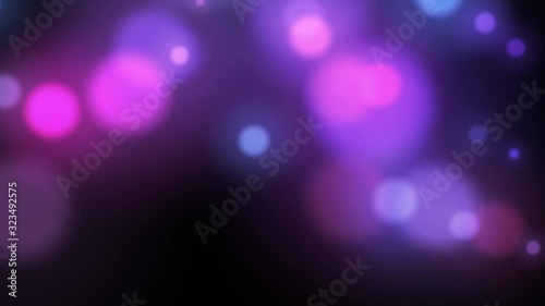 Abstract bokeh light particles on dark background