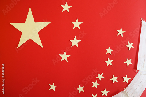 Chinese flag on which lie medical masks. 2019-ncov concept