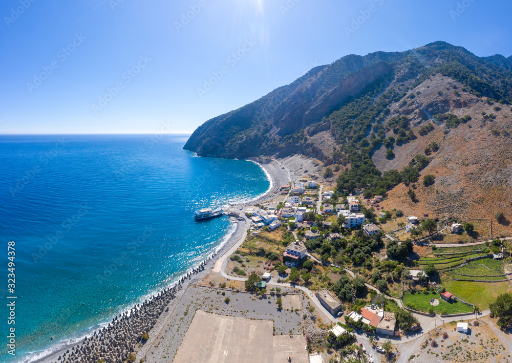 Aerial panoramic shot of Agia Roumeli beach in Chania of Crete, Greece. The village of Agia Roumeli is located at the entrance of the gorge Samaria