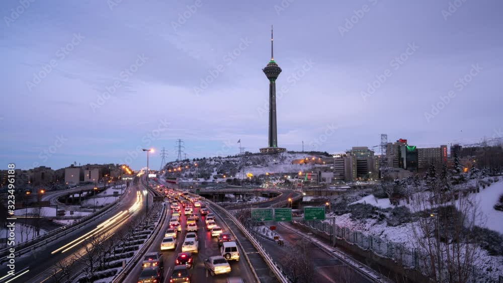 Sunrise of an Snowy morning, A View of an expressway in Tehran and Milad tower. 