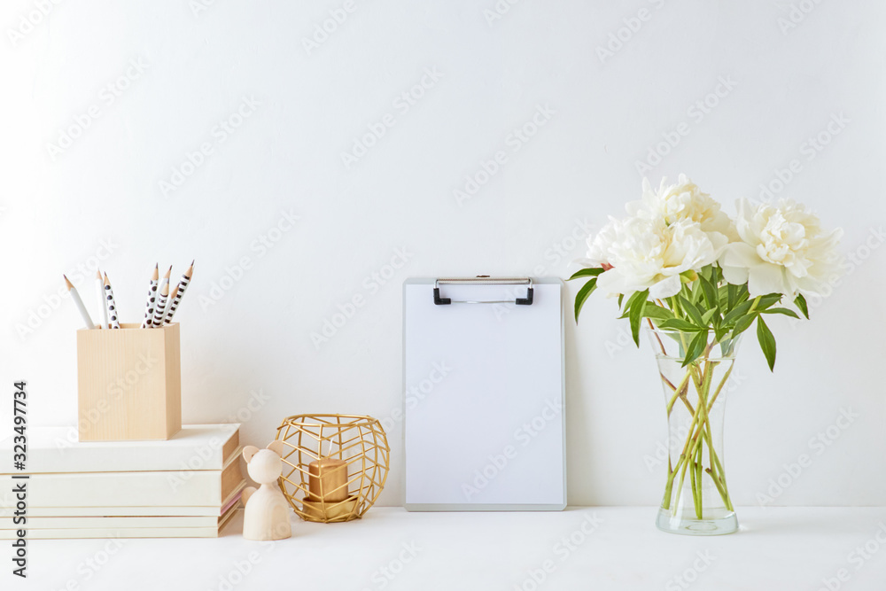 Home interior with decor elements. Mockup clipboard, white peonies in a vase, interior decoration - obrazy, fototapety, plakaty 