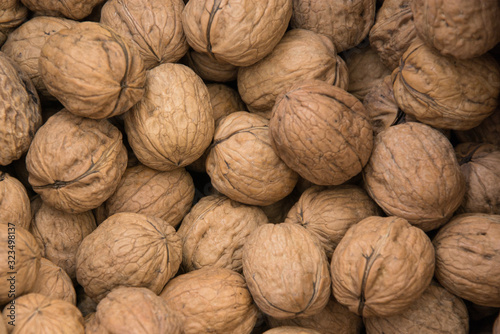 Obraz na plátně Texture of whole walnuts. Juglans Regia