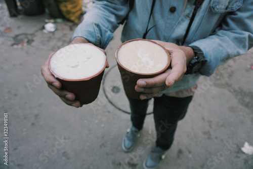 Street food travel , having sweet lassi at Delhi, india, Old delhi