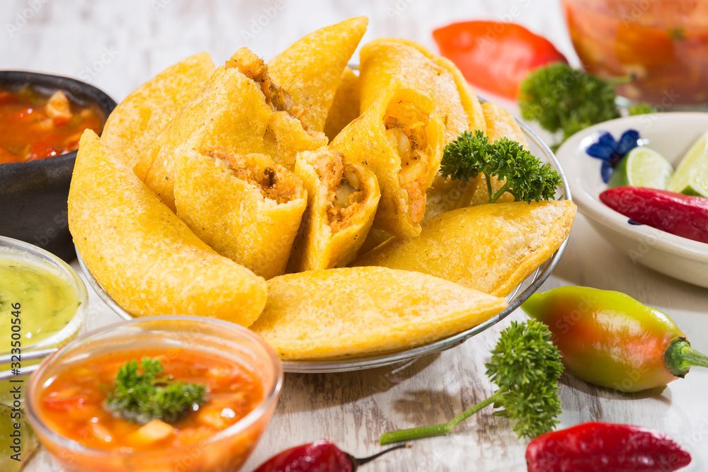 Empanadas with hot sauce, traditional Colombian food Empanadas with hot sauce, traditional Colombian food