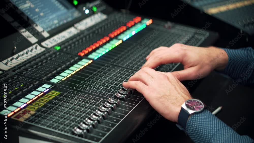 Sound Engineer Moving Sliders In Radio Station.Sound Designer Used