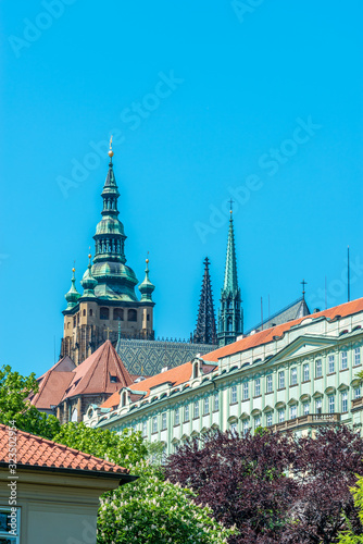 View of the top of old buildings with red roof and blue sky at Prague city Czech republic.