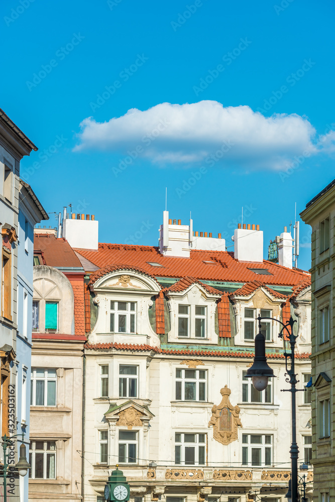 View of the top of old buildings with red roof and blue sky at Prague city Czech republic.