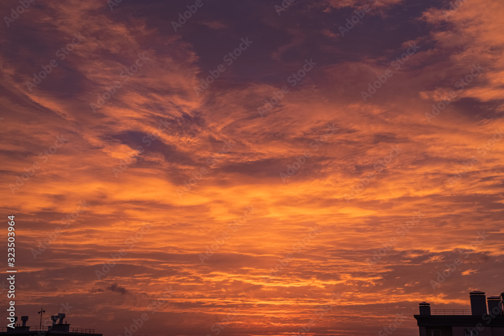 Landscape with a beautiful, cloudy sky in the colors of dawn
