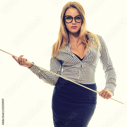 Strict teacher with a pointer in his hand