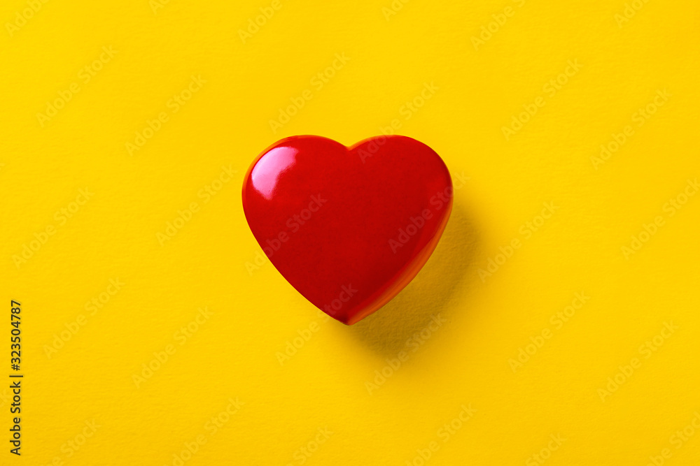 red heart on a yellow background, symbol of love, blank for Valentine's Day