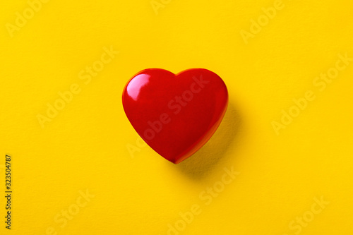 red heart on a yellow background, symbol of love, blank for Valentine's Day