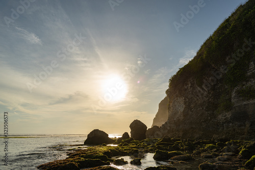 Cliff on coast under sun stock photo