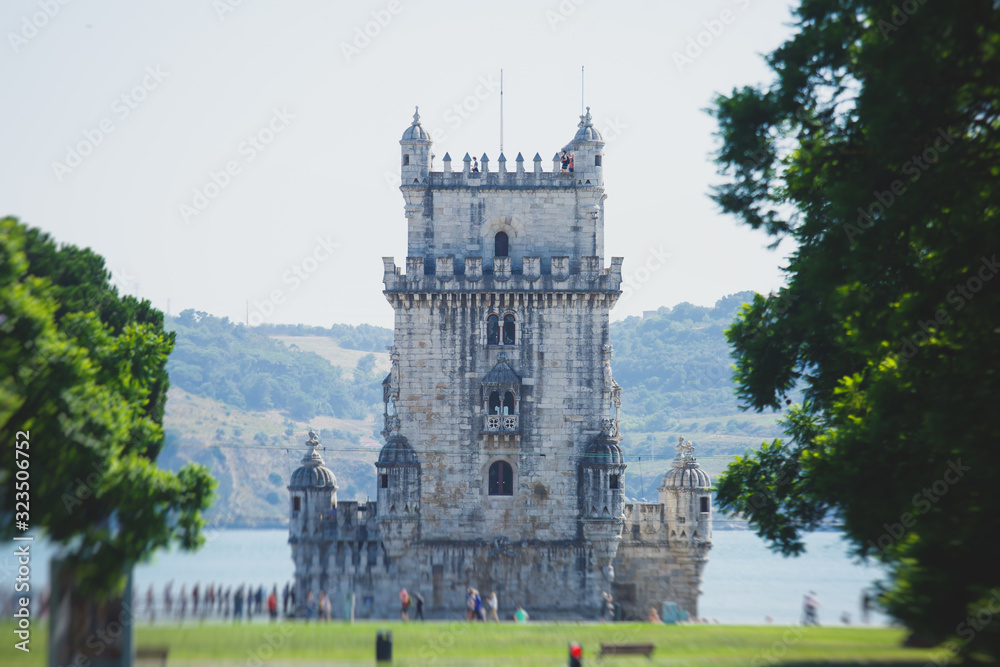 Fototapeta premium View of Belem district, civil parish of the municipality of Lisbon, Portugal, with Belem Tower, Torre de Belem in Portuguese, a prominent example of the Portuguese Manueline style