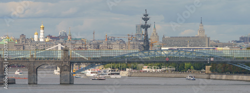 Moskva River and Peter the Great Statue made of Zurab Tsereteli in summer day. Kremlin in distance. Ivan the Great Bell Tower, Famous historical monument. 