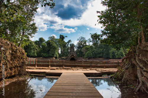 Neak Poan is an artificial island with a Buddhist temple on a circular island in Cambodia