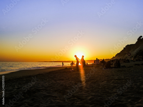 Sunset at Carvoeiro beach, Algarve, Portugal.