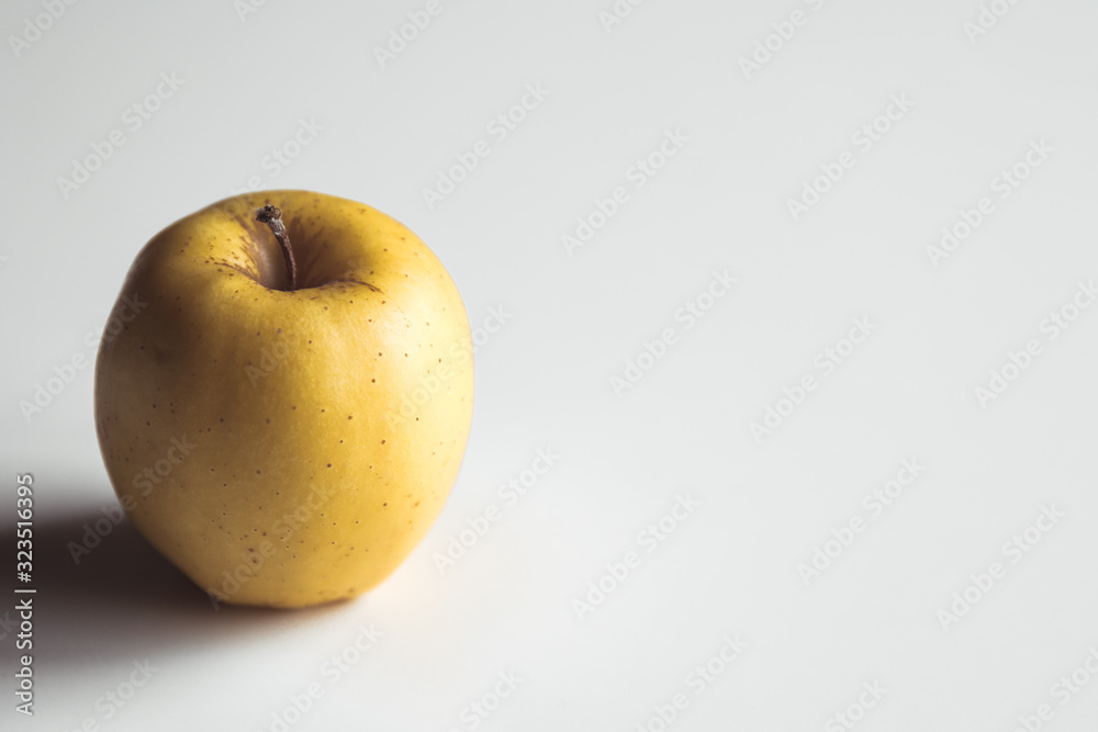 Yellow apples on a white background, wholesome food, farming, vegetarian Yellow apples on a white background, wholesome food, farming, vegetarian