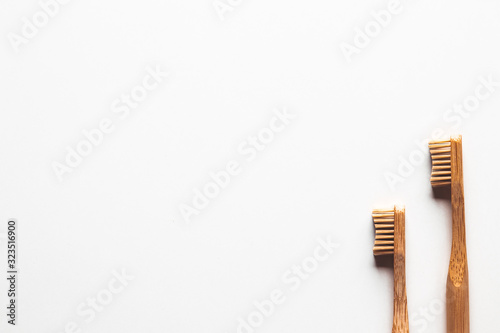 Wooden bamboo toothbrushes on white background isolated. The concept of zero waste  recycling