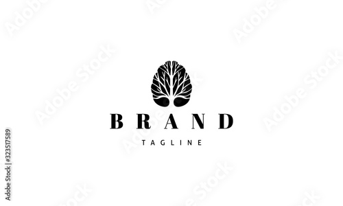 Vector logo on which an abstract image of the brain inside which is a tree silhouette.