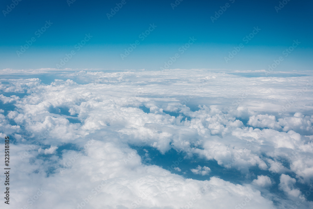 Sky with clouds from airplane window during flight. Sky with clouds from airplane window during flight.
