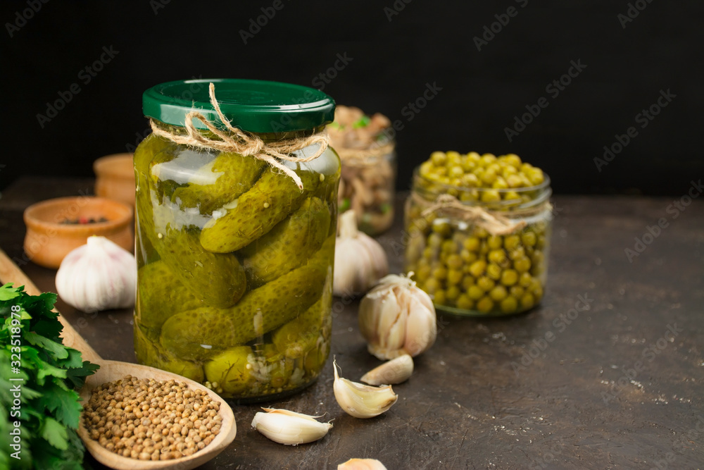 Homemade salted cucumbers ha against a dark background, close-up. Organic, healthy food. Fermented food. Copy space. Homemade salted cucumbers ha against a dark background, close-up. Organic, healthy food. Fermented food. Copy space.