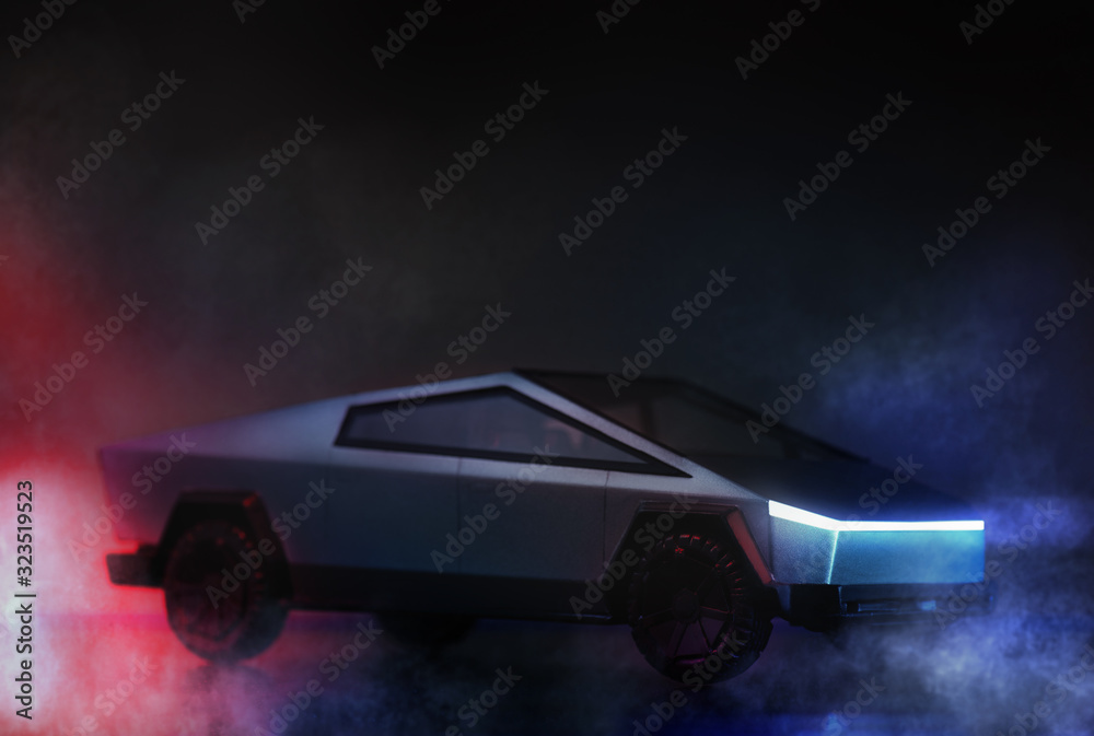 Tesla brand cybertruck pickup car on a dark background with lights. Stock  Photo | Adobe Stock