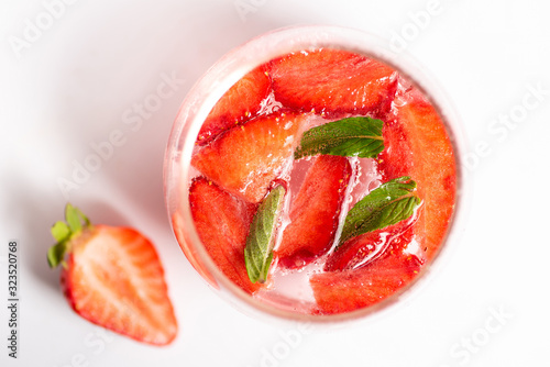 Strawberry juice in a glass isolated