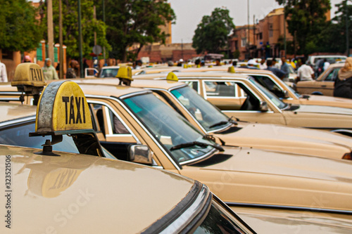 row of old taxis in morocco