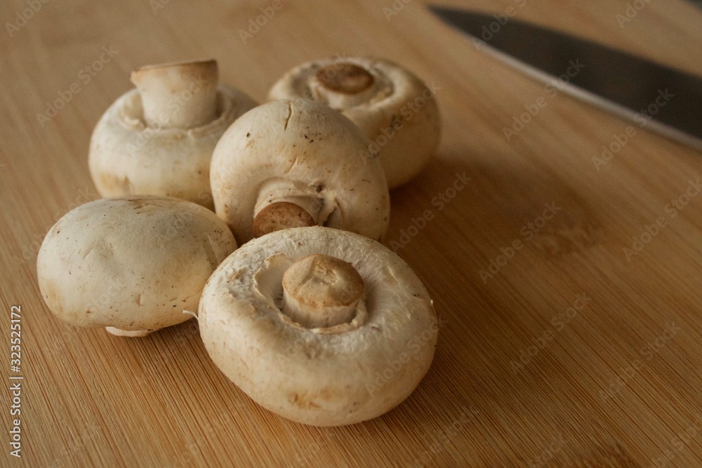 Mushrooms on a wooden cutting board