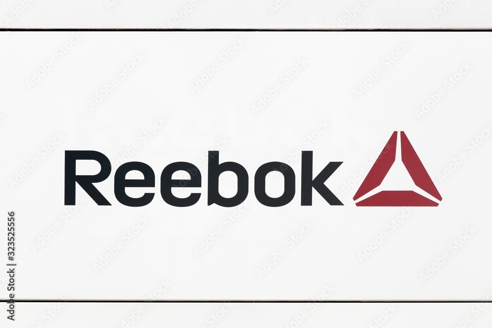 Hamburg, Germany - July 2., 2017: Reebok logo on a wall. Reebok is a global  athletic footwear and apparel company, operating as a subsidiary of Adidas  since 2005 foto de Stock | Adobe Stock