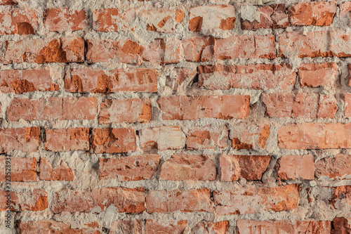 Texture of the old red-orange brick wall, background