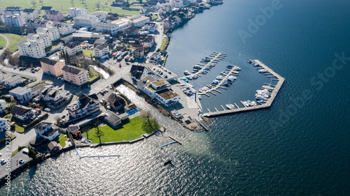 Photography drone photo above the lake of Zug with a boat bridge