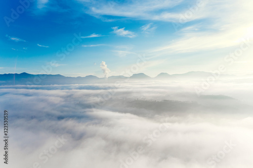 Aerial landscape of fluffy cloud above highlands