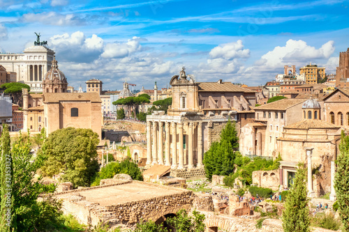 Panoramic cityscape view of the Roman Forum and Roman Altar of the Fatherland in Rome, Italy. World famous landmarks in Italy during summer sunny day