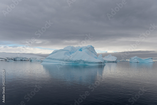 Antarctic landscape with iceberg, view from expedition ship
