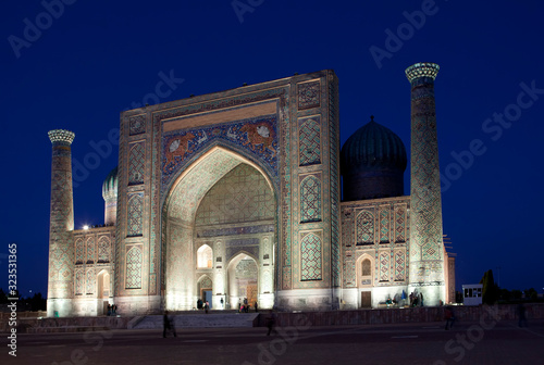 Sher-Dor Madrasah on Square Registan, the inscription above the gate in a special Arabic script it says "Lord Almighty!" . Samarkand. Uzbekistan...