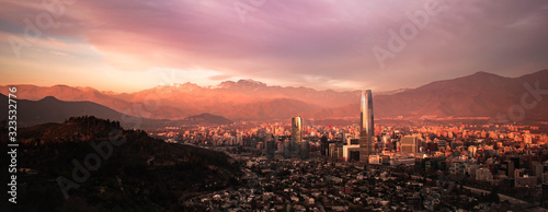 skyscrapers at sunset with mountain