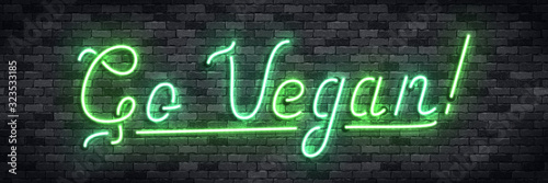 Vector realistic isolated neon sign of Go Vegan logo for decoration and covering on the wall background. Concept of vegetarian cafe and eco product.