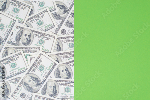 Photo of two parts of different background with seamless repeat paper us cash and bright green for design or text