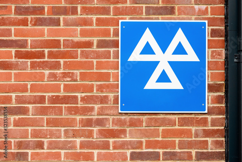 Car diagnostics sign on a brick wall
